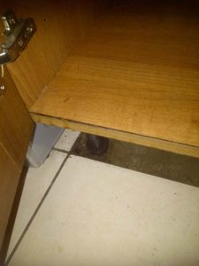 water damaged cupboard